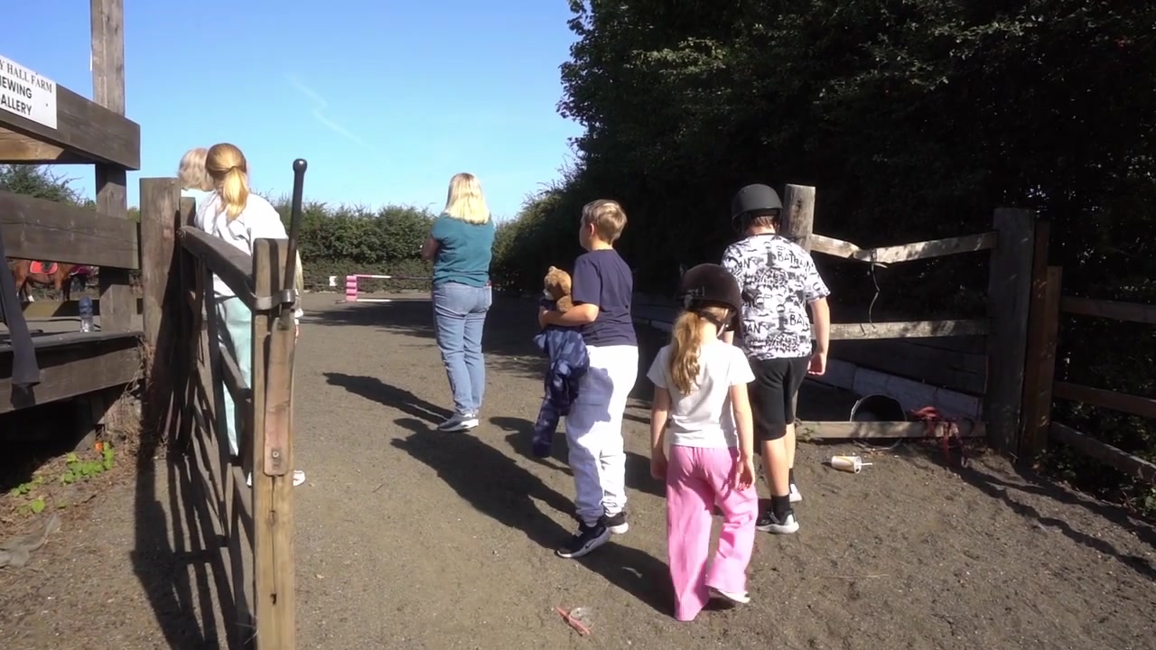 Families arriving for a Stripes activity day at the riding centre
