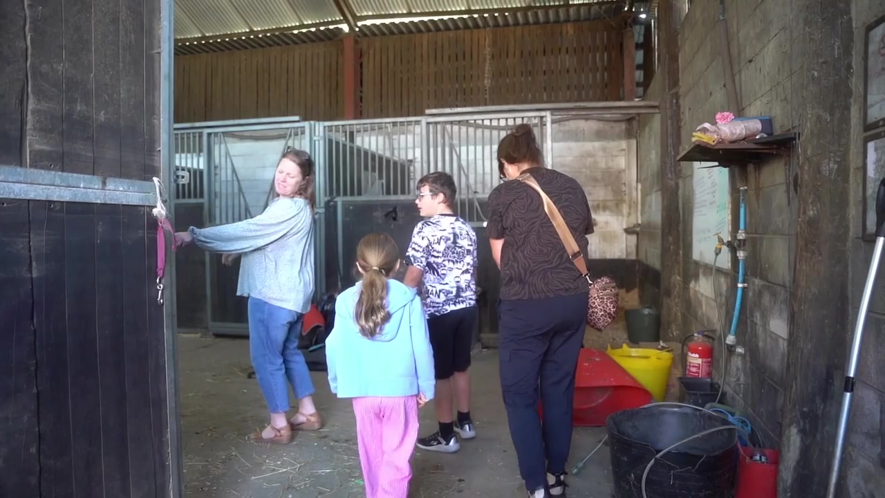 Families spending time together at the riding centre